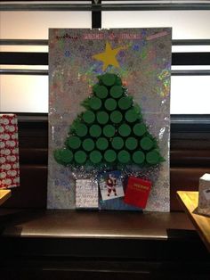 a christmas tree made out of green buttons