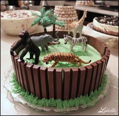 a cake with animals and zebras on it