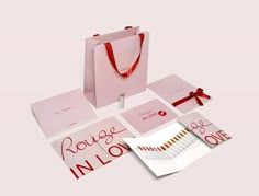 pink shopping bag with red ribbon and matching stationery for valentine's day in london