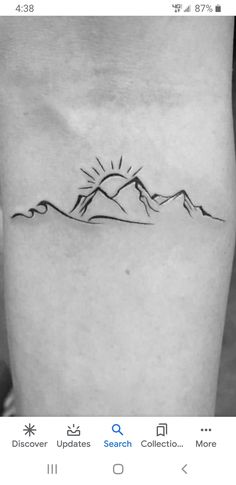 a black and white photo of a mountain tattoo