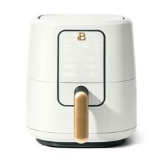 a white blender with a wooden handle on it