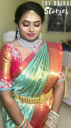 a woman in a colorful sari and jewelry