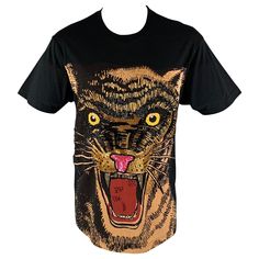 GUCCI F/W 2019 oversized t-shirt comes in a black jersey cotton knit material featuring a feline print with bead and sequin embroidery design at front and a crew-neck. Made in Italy.New with Tags. Marked: XXS Measurements: Shoulder: 21.5 inches Chest: 43 inches Sleeve: 8.5 inches Length: 31 inches Reference: 124905 Category: T-shirt More Details Brand: GUCCI Size: XXS Gender: Male Color: Black Color 2: Gold Pattern: Embroidery Fabric: Cotton Style: Crew-Neck Condition: 1. New wtih Tags Age Group: Adult Gucci Outfits, Embroidery Cotton, Sequin Embroidery, Gold Embroidery, Sequins Embroidery, Embroidery Fabric, Gold Pattern, Oversized T Shirt, Designer Style