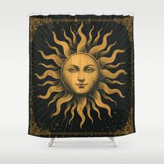 a shower curtain with an image of the sun and moon on it's face