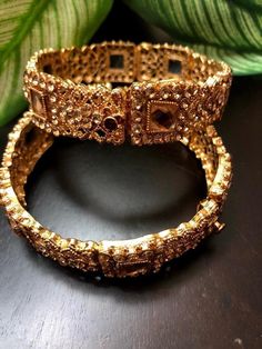 *Picture may be stretched or enlarged to show detail* Golden/bronze cuff bracelet pair embellished with rose gold stones - perfect for any occasion! Size: 2.6  *Openable to adjust size accordingly* Gold Plated Jeweled Bracelet, Gold Jeweled Cuff Bracelet For Party, Gold-plated Jeweled Bracelet, Jeweled Gold-plated Bracelet, Ornate Bangle For Formal Occasions, Metal Bracelets For Wedding, Ornate Jewelry With Stone Setting For Formal Occasions, Ornate Jewelry For Formal Occasions With Stone Setting, Festive Jeweled Metal Bracelets