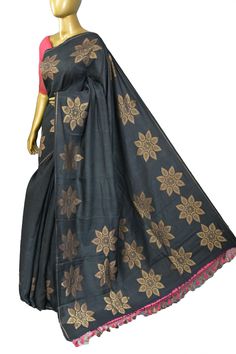 Come up with a different style with our new muga banarasi saree with a fantastic floral motif design on the body and golden zari work all over the saree, making this saree a distinguished piece in a lovely shade of coal black color. Color: A shade of coal black color Technique: Comes with allover zari work with floral pattern work on the body Fabric: Muga Silk Quality: Indyvogue's Assurance of Pure Silk Mark Certified Saree Transitional Cotton Silk Saree With Resham Embroidery, Transitional Season Cotton Silk Saree With Resham Embroidery, Cotton Silk Embroidered Fabric For Designer Wear, Navratri Cotton Silk Embroidered Saree, Cotton Silk Embroidered Saree For Navratri, Cotton Silk Saree With Zari Embroidery, Designer Cotton Silk Embroidered Fabric For Diwali, Designer Wear Embroidered Fabric With Zari Weaving, Diwali Designer Wear Cotton Silk Embroidered Fabric