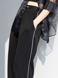 MO&Co. Women Waistbands Drawstring Straight Pants Features : - Straps - Sports style - Double side slip pocketsCode : MBB2PATT03Length of size M is 106.5cmBlack : Model is 178cm tall and wearing a size M MATERIALS & CARE : Material : 76.3% Acetate 23.7% PolyesterMachine wash under 30℃ Do not bleach, hang to dry in the shade Do not tumble dry, iron at low temperature Do not dry clean, do not soak Wash with neutral detergent Reverse into mesh bag for washingTips ：Do not rub and iron special proces Black Drawstring Sportswear Pants, Black Sports Pants For Summer, Athleisure Bottoms With Contrast Trim For Loungewear, Black Drawstring Pants For Summer, Black Drawstring Summer Pants, Black Summer Pants With Drawstring, Black Drawstring Sweatpants For Sports, Black Sweatpants With Drawstring For Sports, Stretch Pants With Side Stripes For Jogging