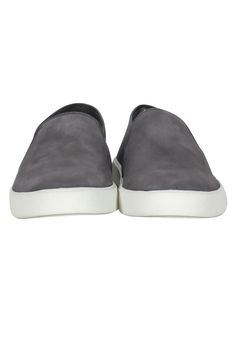 Slip on some serious sporty chic style with these sneakers from Vince! Made with a soft suede design and slip-on style, these grey beauties are weekend-ready. Whether you're headed to brunch or bopping around town, style these with joggers and a graphic sweatshirt and you'll be ready to hit the streets! Size 5 Suede upper Manmade sole Slip on Round toe No visible wear Box included Length 9.75" Gray Sporty Slip-ons For Sports, Casual Suede Slip-ons For Everyday, Casual Suede Slip-on Sneakers, Casual Slip-on Sneakers With Suede And Contrast Sole, Comfortable Suede Low-top Slip-ons, Gray Low-top Casual Slip-ons, Casual Suede Slip-on Sneakers With Contrast Sole, Casual Suede Slip-ons With White Sole, Gray Casual Slip-on Sneakers