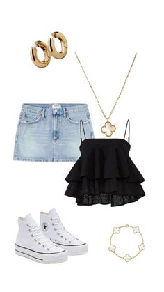 a pair of high waisted shorts, black top and white converse sneakers with gold accessories