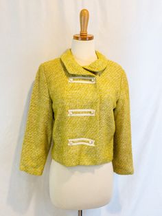 "Vintage lime green tweed blazer  White Vinyl covered buttons and detail  Bright buttercup yellow satin lining Button closure. There is a snap closure near collar -  one side has become unstitched. We are leaving it up to the buyer to decide if want that snap closure. Buyer can reattach or remove. Overall good vintage condition from the 1950s.  Union tag No size or maker tag Best fit: Small Measures: 17.5\" armpit to armpit, 19.25 sleeve, 19\" shoulder to hem, 15\" between shoulder seams across back" Fitted Green Tweed Jacket With Button Closure, Vintage Yellow Formal Blazer, Yellow Vintage Blazer For Formal Occasions, Yellow Formal Blazer With Buttons, Formal Yellow Blazer With Buttons, Vintage Formal Tweed Jacket For Spring, Spring Wool Tweed Jacket With Buttons, Formal Vintage Yellow Outerwear, Vintage Single-breasted Tweed Jacket For Spring