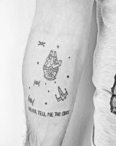 a man with a star wars tattoo on his arm and the words never tell me the odds