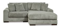 a large gray couch with pillows on it's back and foot rests in front of a white background