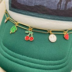 Add some bling and personality to your trucker hat or baseball cap. This lucky style is so trendy with cherry, clover, hearts, & smiley charms. Clasps included and are easily attached to the mesh on the cap. Take your style up a notch! Cap not included. //CAP CHAIN SHOWN IN LISTING// Lightweight Large Paper clip link chain gold plated Clasps on ends to attach in mesh Nickel Free components Chain part measures 8″ Fits trucker or regular ball caps Jewelry arrives gift ready in a lovely box. //CARE Hat Charms, Trendy Handmade Hats, Trendy Gold Hat As A Gift, Hat Jewelry, Trendy Adjustable Trucker Hat As Gift, Gold Adjustable Trucker Hat Trendy, Trendy Trucker Hat As Gift, Trendy Trucker Hat Gift, Trendy Adjustable Gold Trucker Hat