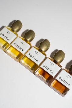 five small bottles of different types of perfumes