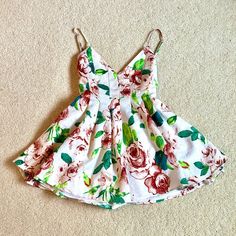 Floral Romper Dress From Lexi Drew, White With Red And Green Roses, Entire Dress Is Double Lined, Adjustable Spaghetti Straps, Low Back, Hidden Zipper In Back, V Neck, Flowy Skirt, It Is Pretty Short But It’s A Romper So It’s Fine And Looks Like A Dress When On, Never Worn Only Tried On And In Perfect Condition, Measurements Shown In Photos Bundle To Save! Lexi Drew, Green Roses, Pretty Shorts, Green Rose, Floral Dress Summer, Romper Dress, Flowy Skirt, Floral Romper, Low Back