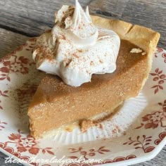 a slice of pumpkin pie with whipped cream on top