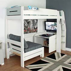 a white loft bed with desk and computer