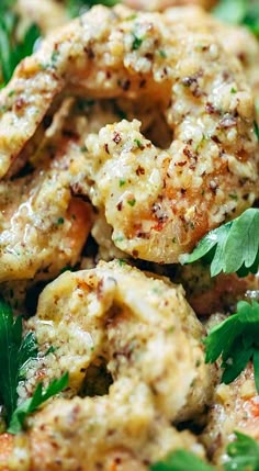 closeup of cooked shrimp with herbs and parsley on the side, ready to be eaten