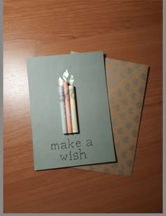 two cards that say make a wish and one has an eraser on top of it