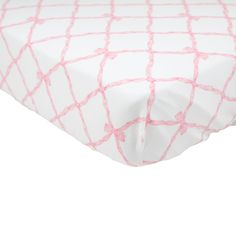 a white and pink bed sheet with lines on it