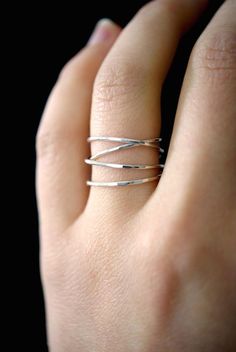 This item is made to order and will ship after 7-10 business days. That time does not include holidays, weekends or shipping time!This item is hand-crafted and made to order in Portland, OR.This is a large, four-loop version of my popular Wraparound ring! This ring makes a gorgeous, delicate and minimalist cocktail ring.I wrap a length of silver around four times and securely solder it around back. Then I lightly hammered the ring for a bright, reflective shine.The beauty of this ring lies in it Minimalist Cocktail, Silver Wire Rings, Gold Wrap Ring, Criss Cross Ring, Silver Wrap Ring, Woven Ring, Wire Rings, Cross Ring, Sell Gold