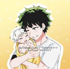 a man holding a baby in his arms while wearing a white shirt and green hair