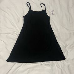 Nwt Brand New With Tags Plain Black Spaghetti Strap Dress. Perfect For A Casual Day. From A Non Smoking Household Black Sleeveless Mini Dress With Adjustable Straps, Black Cami Mini Dress, Black Cami Dress For Spring, Black Casual Cami Dress, Casual Black Cami Dress, Casual Black Spaghetti Strap Dress, Black Cami Mini Dress For Summer, Casual Cami Mini Dress For Night Out, Casual Cami Mini Dress For Date Night