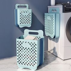 two blue baskets next to a washing machine