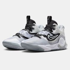 the nike zoom basketball shoe is white and black