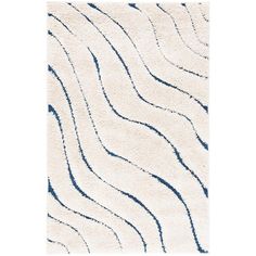 a white rug with wavy lines on the top and blue stripes on the bottom,