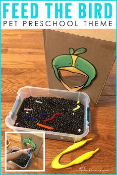 a box filled with lots of black beans next to scissors and paper clippings