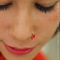 a close up of a person with a nose piercing