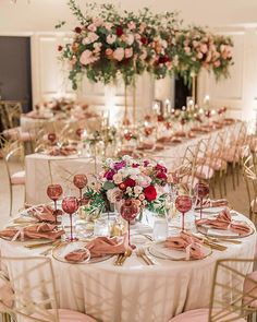 the tables are set with wine glasses and place settings