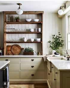 the instagram page shows an image of a kitchen with wooden cabinets and open shelving