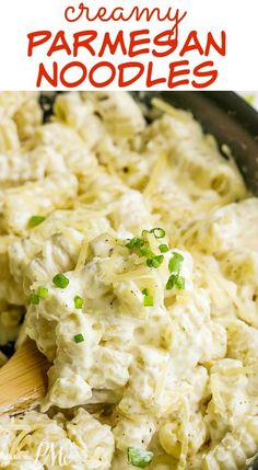 creamy parmesan noodles in a skillet with a wooden spoon and text overlay