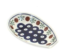 a small blue and white bowl with circles on it