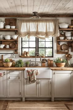 a kitchen with white cabinets and wooden shelves