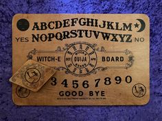 an old fashioned wooden sign with the letters and numbers on it's back side