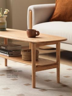 a coffee table with a cup on it in front of a couch