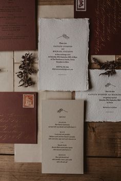 the wedding stationery is laid out on top of each other