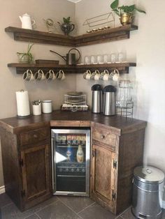 an appliance in the corner of a kitchen with shelves above and below it