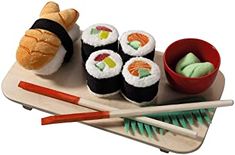 sushi and chopsticks on a wooden tray