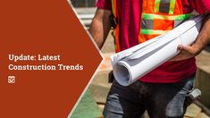 a construction worker holding a rolled up sheet of paper with the words update latest construction trend