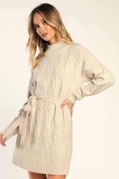 Bundling up for the season has never looked so fabulous thanks to the Lulus Warmed Up To You Cream Cable Knit Mock Neck Sweater Dress! Thick, cozy wool-blend cable knit shapes a mock neckline, long sleeves, and a relaxed bodice. The shift silhouette falls to a cute mini hem and features a tying belt that allows you to cinch the waist. Contrasting ribbed knit accents the neckline, cuffs, and hem. Fit: This garment fits true to size. Length: Mid-thigh. Size medium measures 32.5" from shoulder to h Cozy Long Sleeve Cable Knit Dress, Cozy Cable Knit Long Sleeve Dresses, Winter Cable Knit Sweater Dress, Fall Cable Knit Sweater Dress, Cozy Cable Knit Sweater Dress For Spring, Beige Cable Knit Sweater Dress, Cozy Cream Sweater Dress For Fall, Cozy Cable Knit Sweater Dress For Fall, Fall Cable Knit Turtleneck Sweater Dress