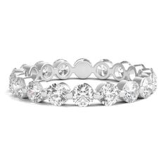 a white gold ring with round cut diamonds on the side and four rows of stones in each