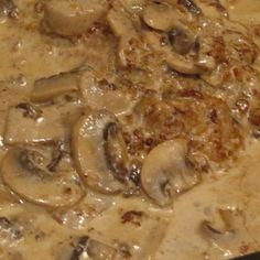 mushrooms are being cooked in a pan on the stove