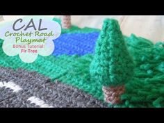 a crochet road playmat with trees on it and text overlay that reads cal crochet road playmat