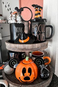 three tiered tray with halloween themed coffee mugs