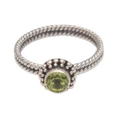 A stunning faceted peridot takes center stage in this lovely ring from artisan Komang Wijayana. Crafted by hand from sterling silver the ring features a beautiful double rope motif along the band with a shimmering crown of traditional Balinese jawan or bubble motifs. The beautiful gemstone sparkles from within a bezel setting completing the elegant design of timeless appeal. Amethyst Cocktail Ring, Single Stone Ring, Sterling Silver Cuff Bracelet, Single Stone, Lovely Ring, Sterling Silver Cuff, Silver Cuff Bracelet, Balinese, Center Stage