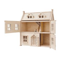 a wooden doll house with stairs and windows